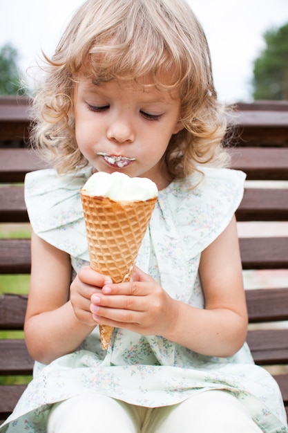 little girl happy to eat ice cream