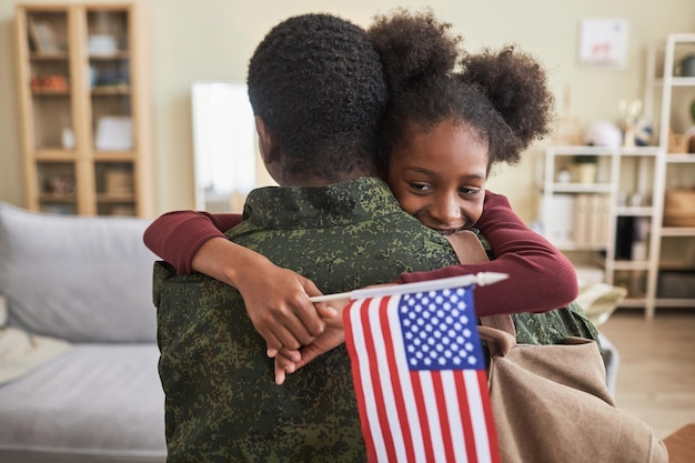 Little girl happy to see her military dad