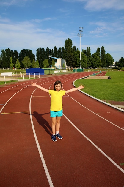 Little girl have fun on the stadium