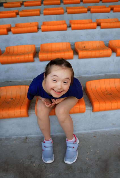 Little girl have fun on the stadium