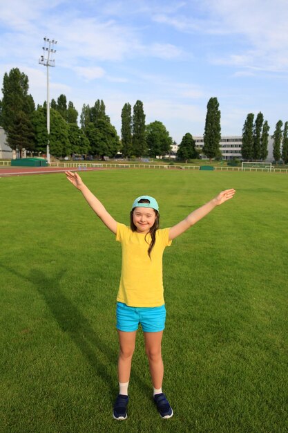 Little girl have fun on the stadium