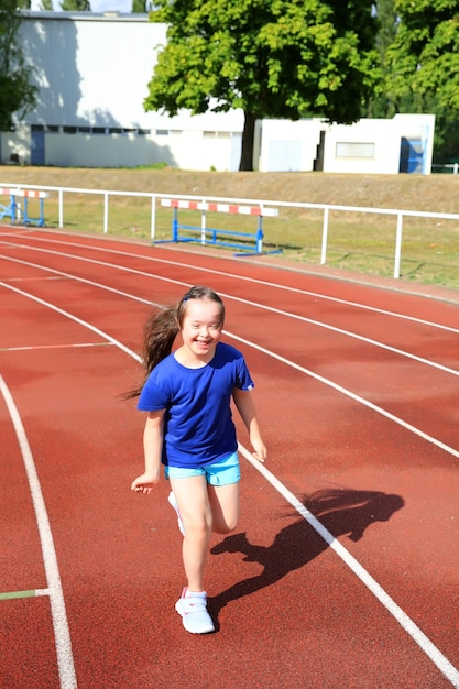 Little girl have fun on the stadium