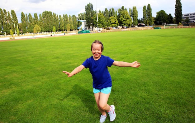 Little girl have fun on the stadium