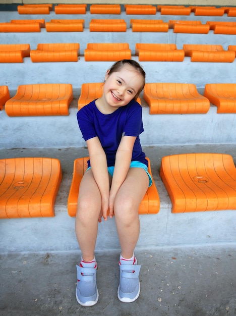 Little girl have fun on the stadium