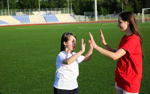 Little girl have fun on the stadium