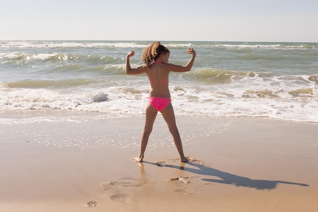 little girl have fun on summer beach summer vacation