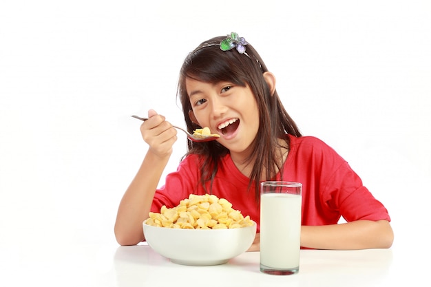 Little girl having breakfast