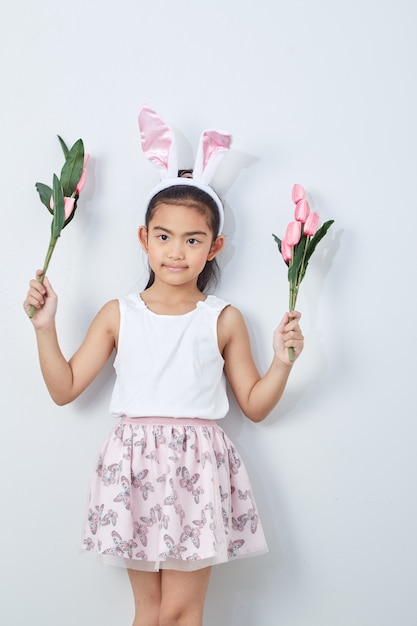 Little girl holding bouquet tulip