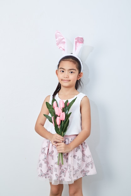 Little girl holding bouquet tulip