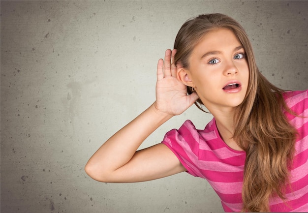 Little Girl Holding Hand on Ear