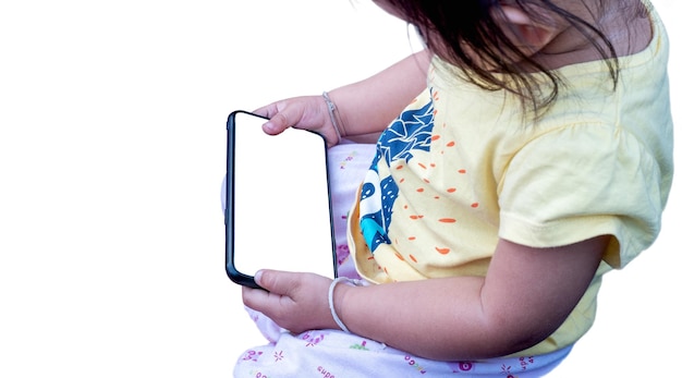 Little girl holding on phone mobile, with blank white screen. Isolated on white background. File contains with clipping path so easy to work.