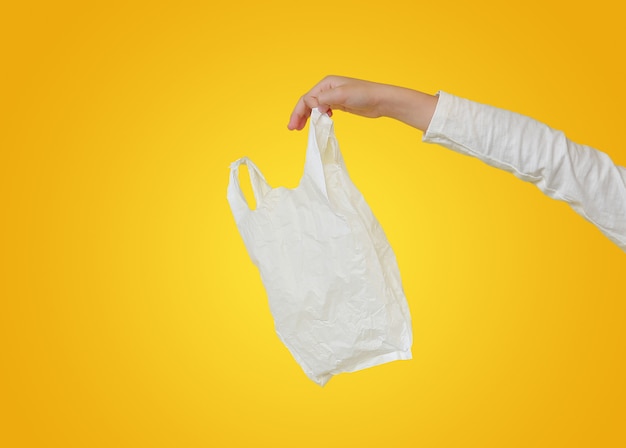 Little girl holding plastic bag