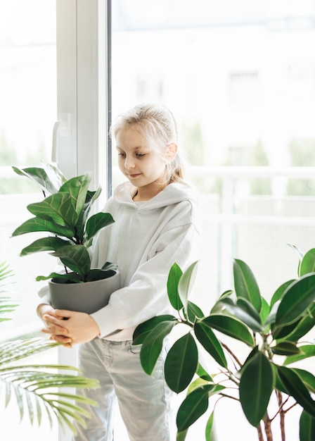 Little girl and houseplants