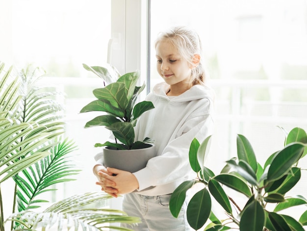 Little girl and houseplants