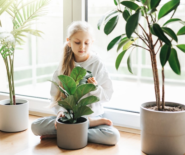 Little girl and houseplants