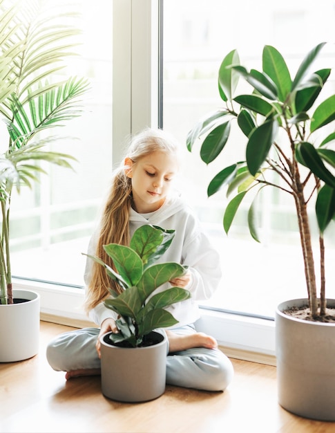 Little girl and houseplants