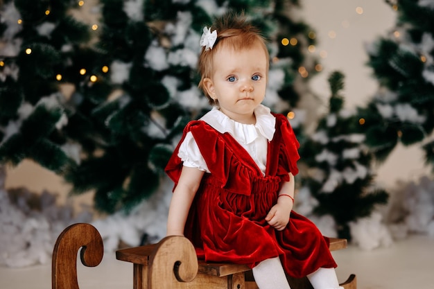 a little girl is enjoying Christmas