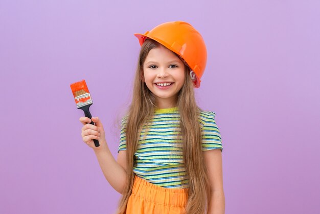 A little girl is going to do repairs in her bedroom. Renovation in the children's room.