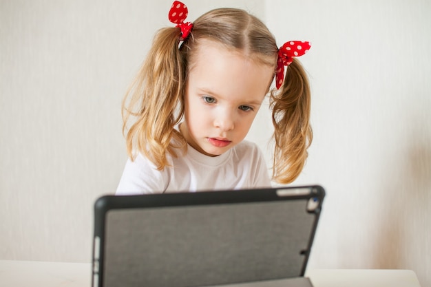 Little girl is talking online