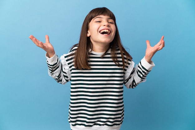 Little girl over isolated background smiling a lot