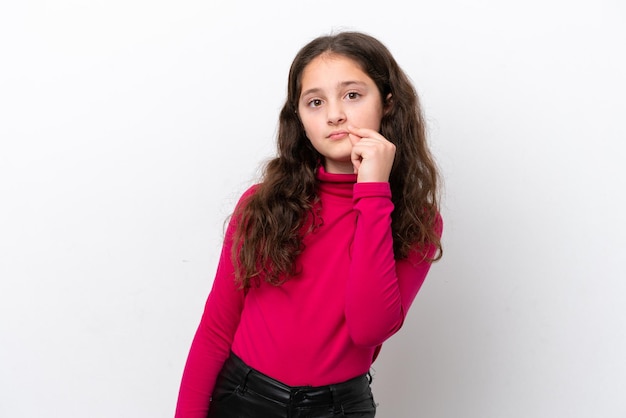 Photo little girl isolated on white background showing a sign of silence gesture