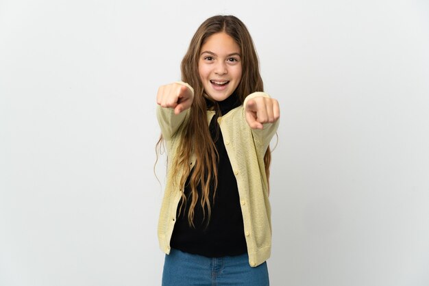 Little girl over isolated white surprised and pointing front