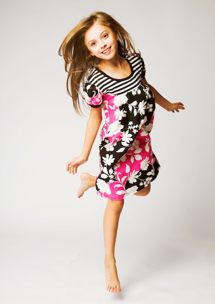 Little girl jumping of joy 