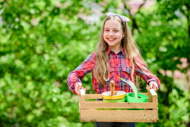 Little girl kid in forest little girl with gardening tools earth day spring village country ecology environment Happy childrens day summer farm Happy childhood Working in green environment