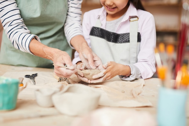 Little Girl Kneading Clay