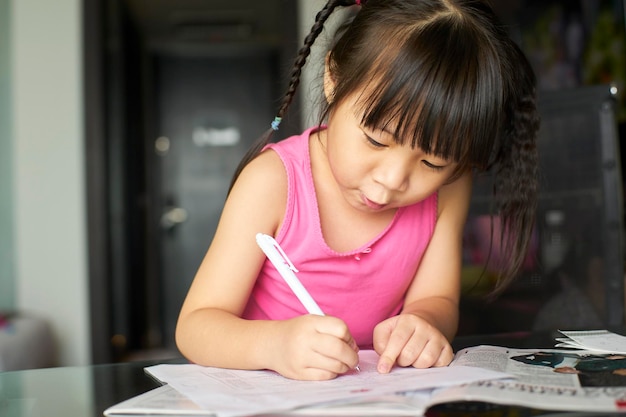 A little girl learning to write