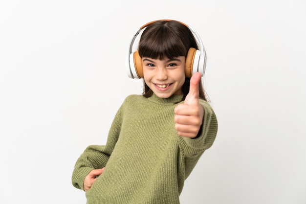 Little girl listening music with a mobile isolated