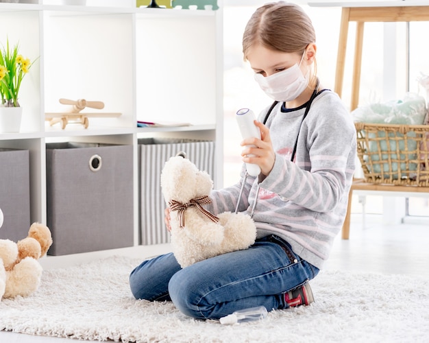 Little girl in medical mask