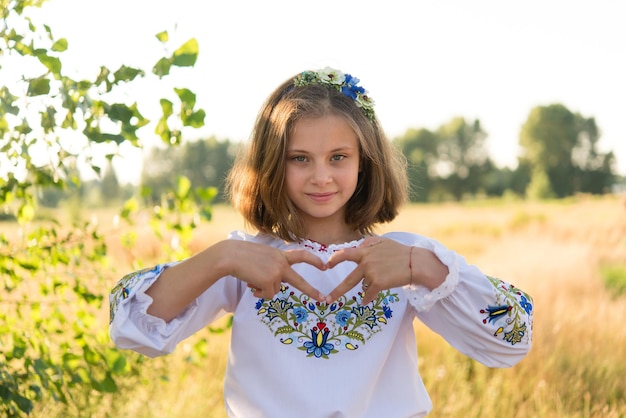 little girl in national Ukrainian clothes - vyshyvanka. Ukraine, child in nature