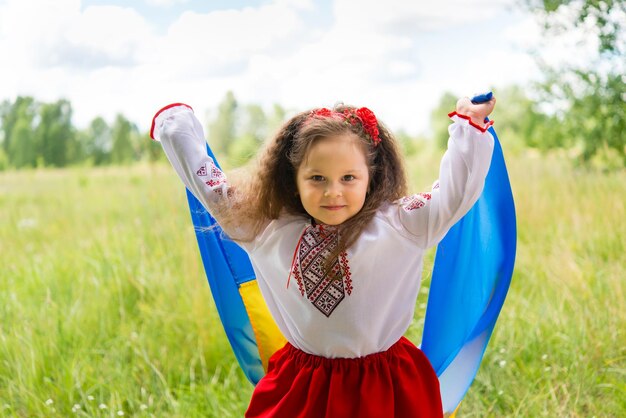 little girl in national Ukrainian clothes - vyshyvanka. Ukraine, child in nature