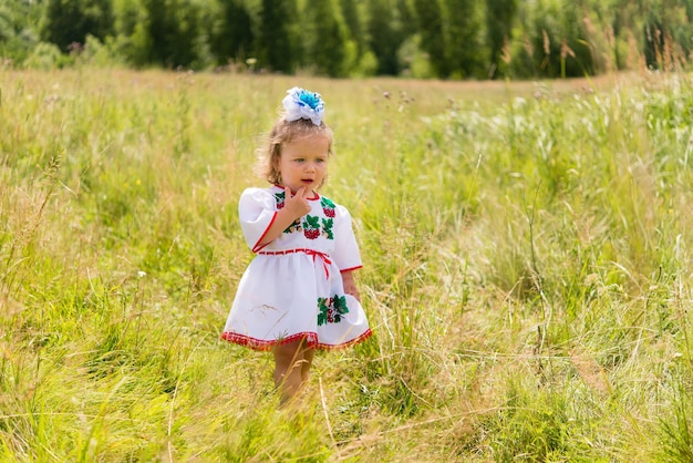 little girl in national Ukrainian clothes - vyshyvanka. Ukraine, child in nature