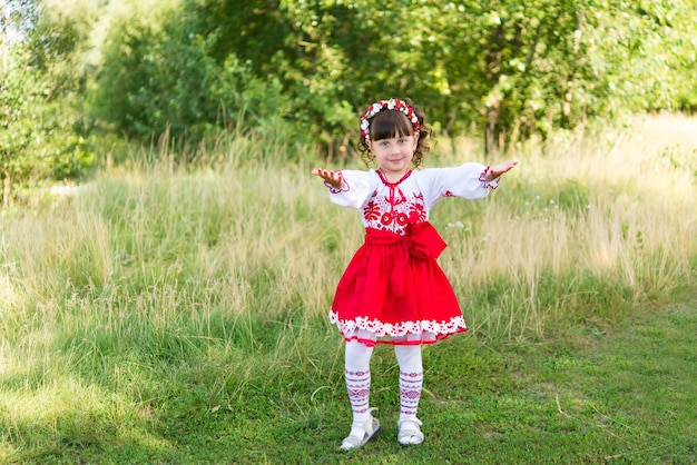 little girl in national Ukrainian clothes - vyshyvanka. Ukraine, child in nature