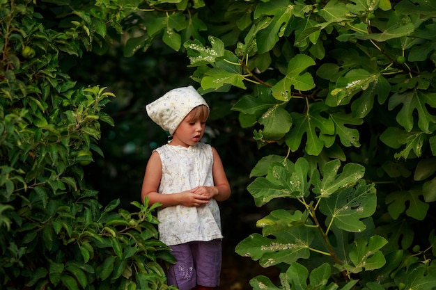 Little girl outside with leaves