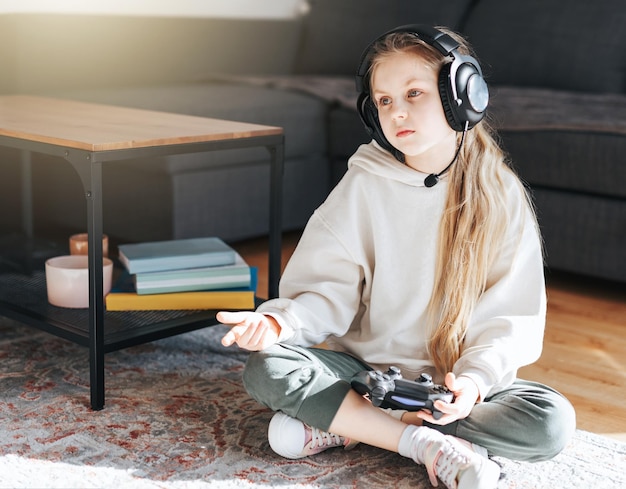 Little girl playing on games console