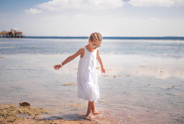 LIttle girl playing near water