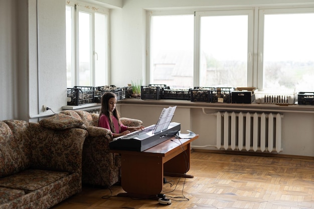 little girl playing the piano in a ruined room.