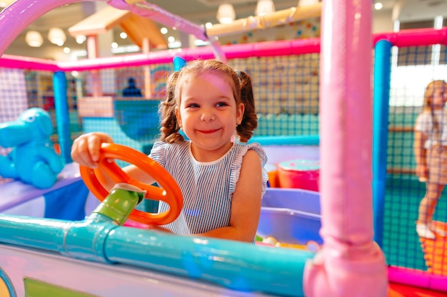 Little girl playing in play center