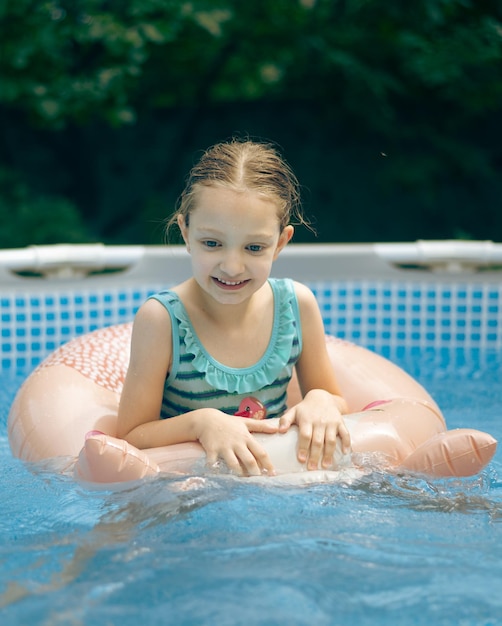 Little girl playing in pool