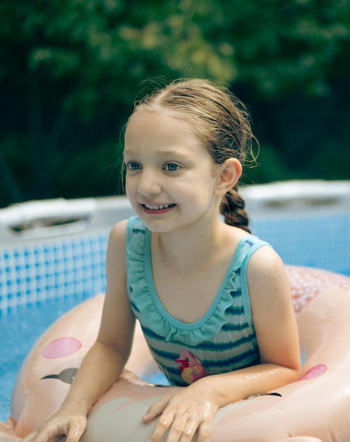 Little girl playing in pool