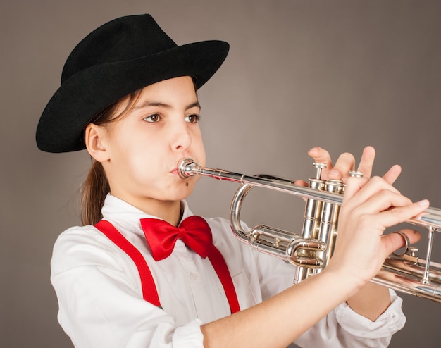 Little girl playing trumpet