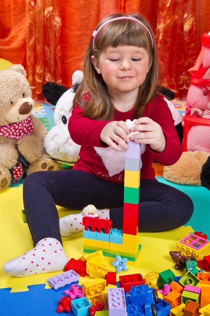 Little girl playing with cubes