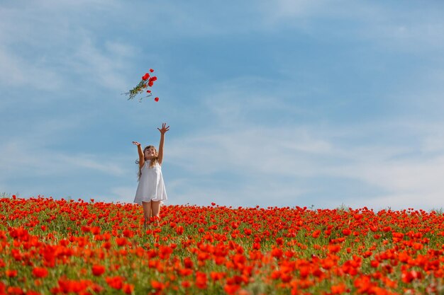 Little girl in a poppy field