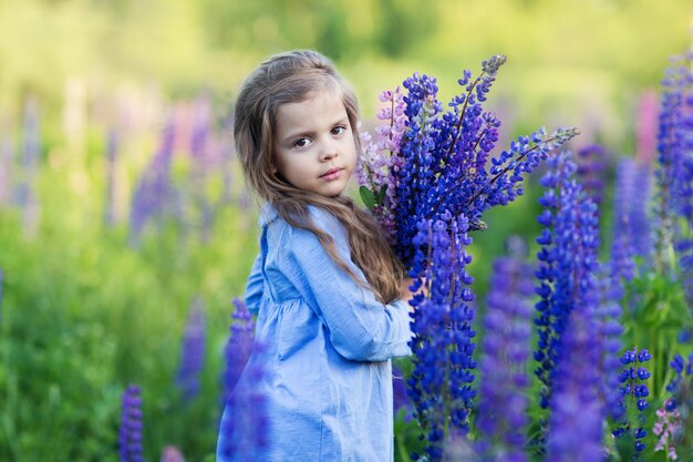 A little girl in purple flowers