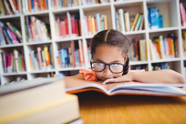 Little girl reading a book