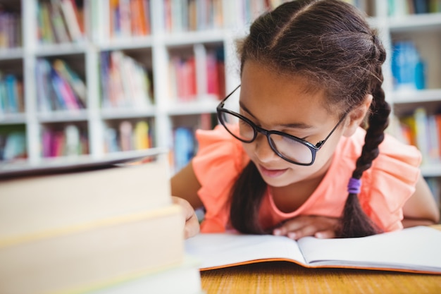 Little girl reading a book