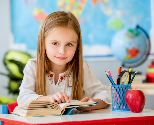 Little girl reading book